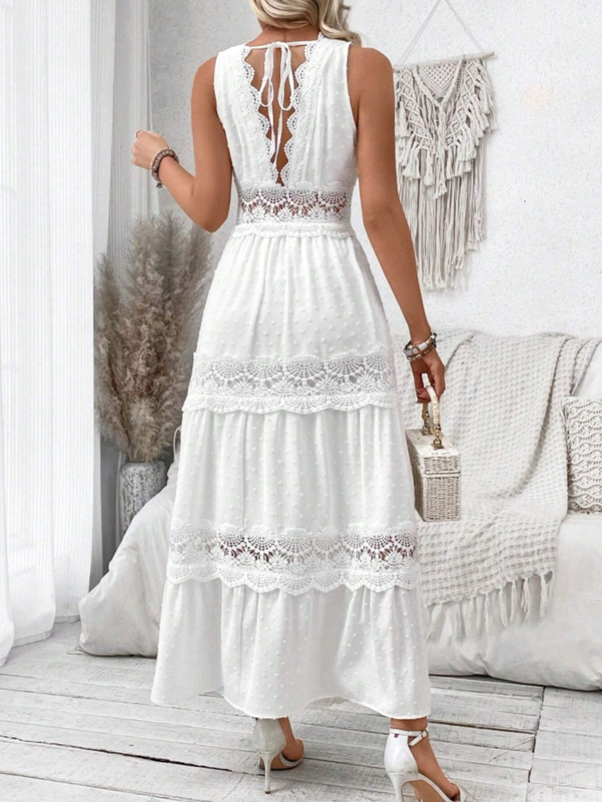 White lace trim Swiss dot maxi dress with tiered skirt and open back tie detail.