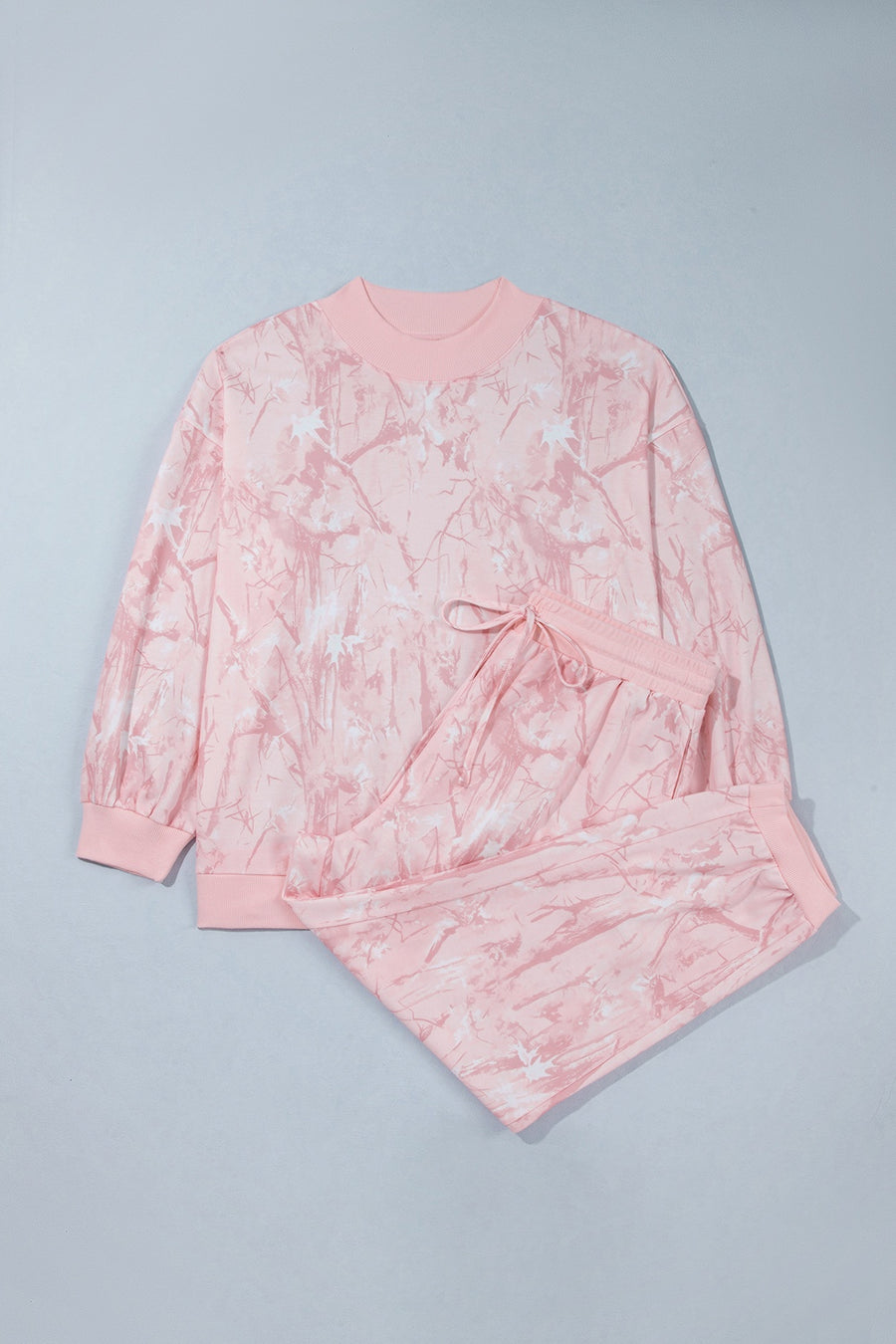 100% polyester Care instructions: Machine wash cold pajama set in light pink with relaxed silhouette