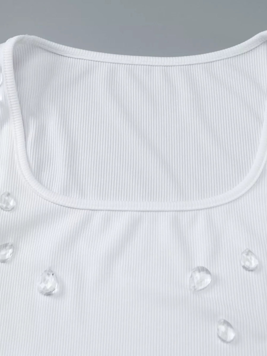 White ribbed square neck tank top with scattered rhinestone embellishments.