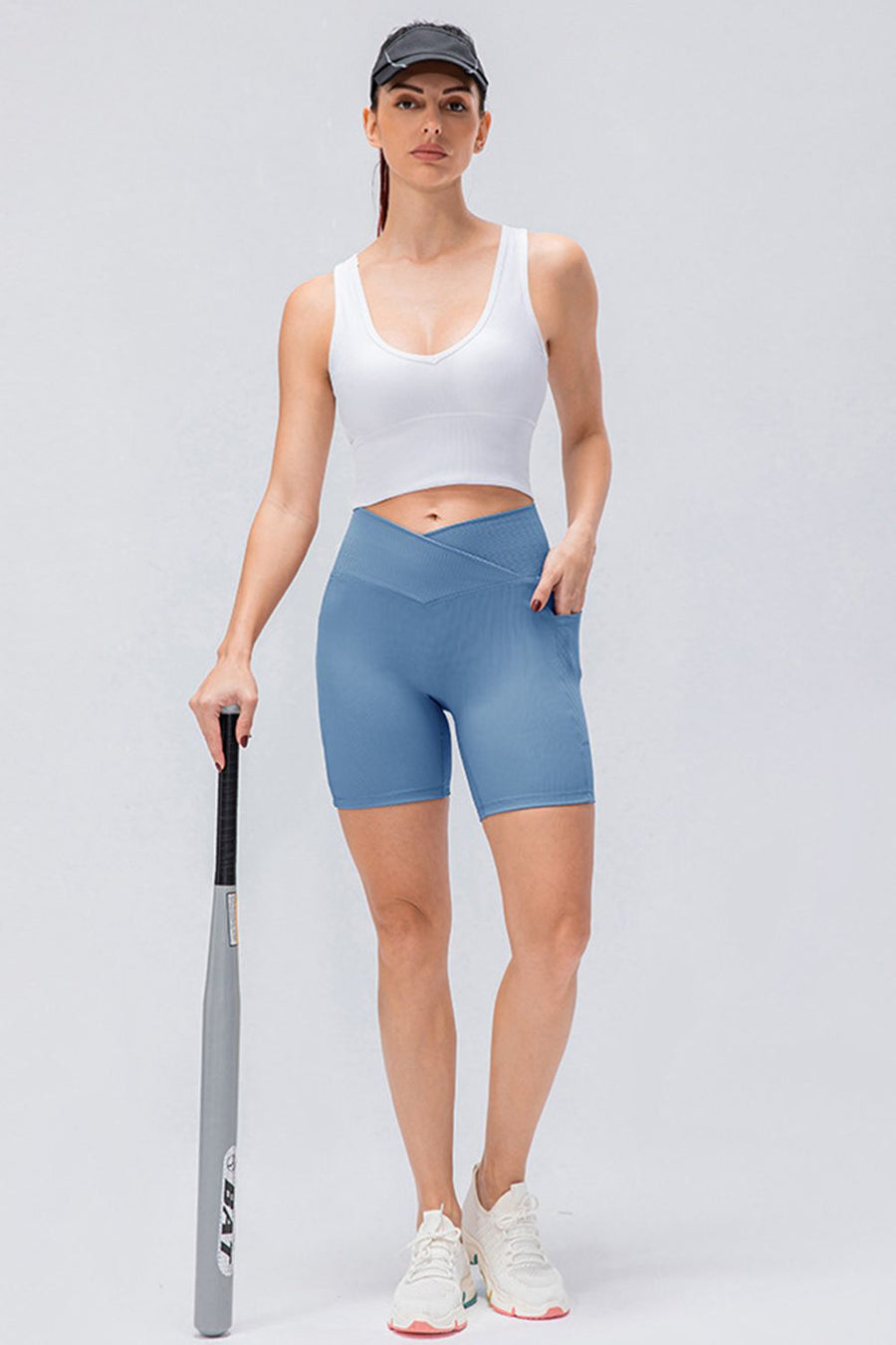 Light Blue cross-waist active bike shorts with pockets and a ribbed texture.