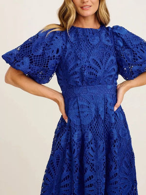 Blue lace midi dress with puff sleeves and intricate cutout pattern.