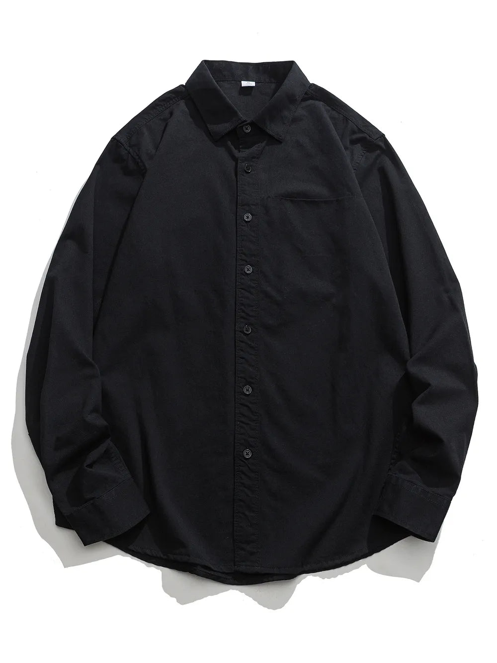Black cotton button-down shirt with a chest pocket and long sleeves.