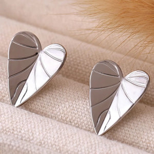 Silver heartleaf stud earrings with detailed vein texture.