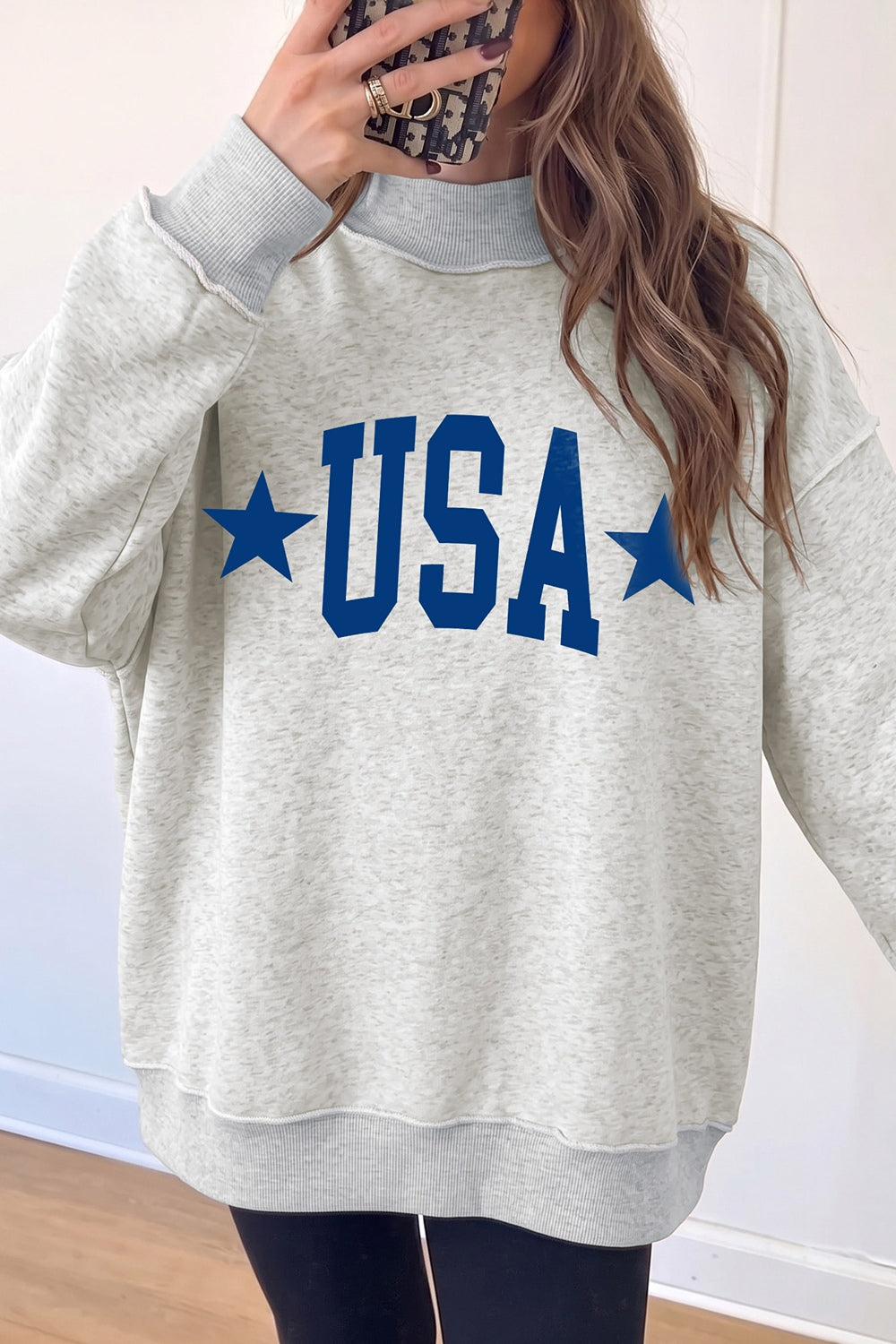 light gray sweatshirt with hip-length and pullover