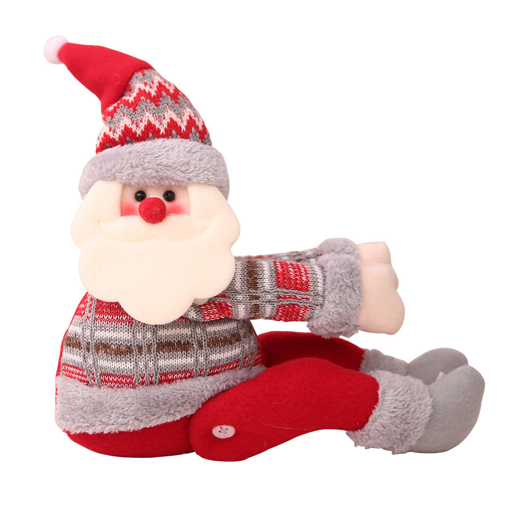 Festive Santa curtain tieback with red, grey, and white plaid sweater and red pants.
