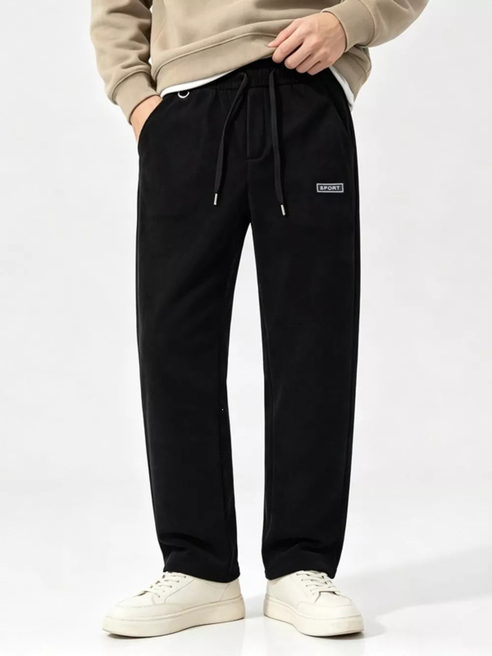 wide-leg pants in black featuring drawstring waist and relaxed fit