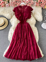 Red lace maxi dress with ruffled short sleeves and high neckline.