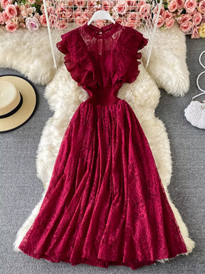 Red lace maxi dress with ruffled short sleeves and high neckline.