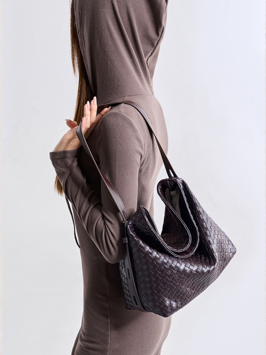 Brown handbag featuring woven texture and woven