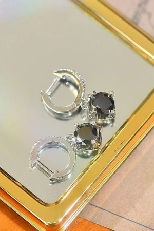 Black square stone hoop earrings with pavé detail on the hoops.