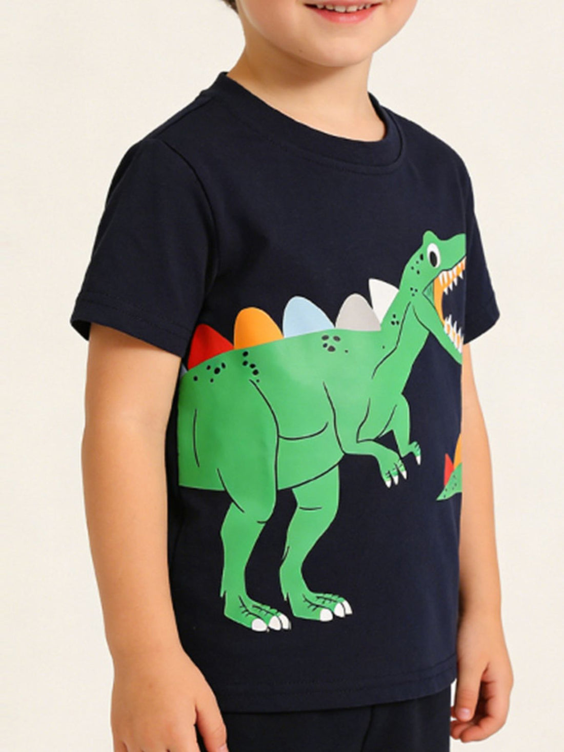 Navy t-shirt with a green dinosaur graphic and colorful spikes, short sleeves.