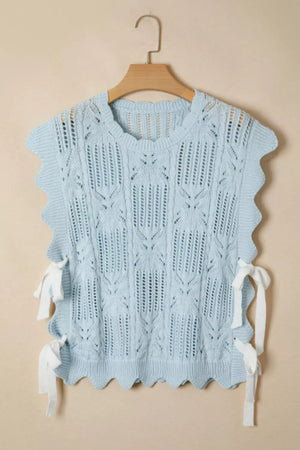 Light blue cable-knit openwork cotton blend top with cap sleeves and tie details.