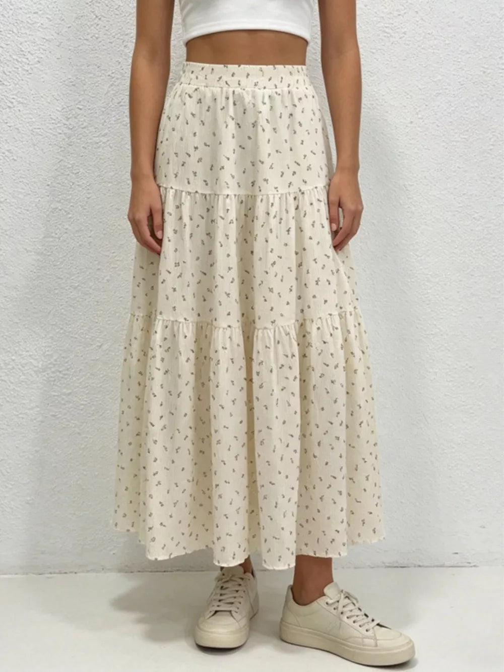 Ruched floral tiered maxi skirt in beige with a comfortable fit.