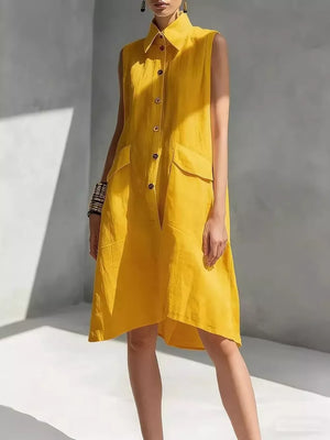 Sleeveless yellow linen shirt dress with button front and flap pockets