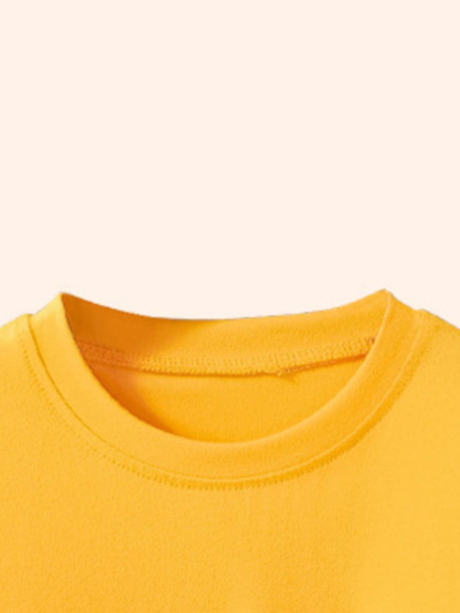Yellow crew neck toddler t-shirt with cartoon graphic detail.