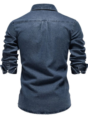 Dark wash denim button-down shirt with a pointed collar and buttoned cuffs.