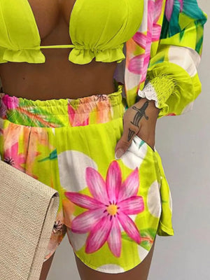 Floral print two-piece outfit set with ruffled trim and smocked cuffs in chartreuse.