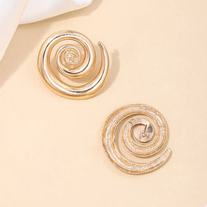 Gold earrings featuring statement and geometric