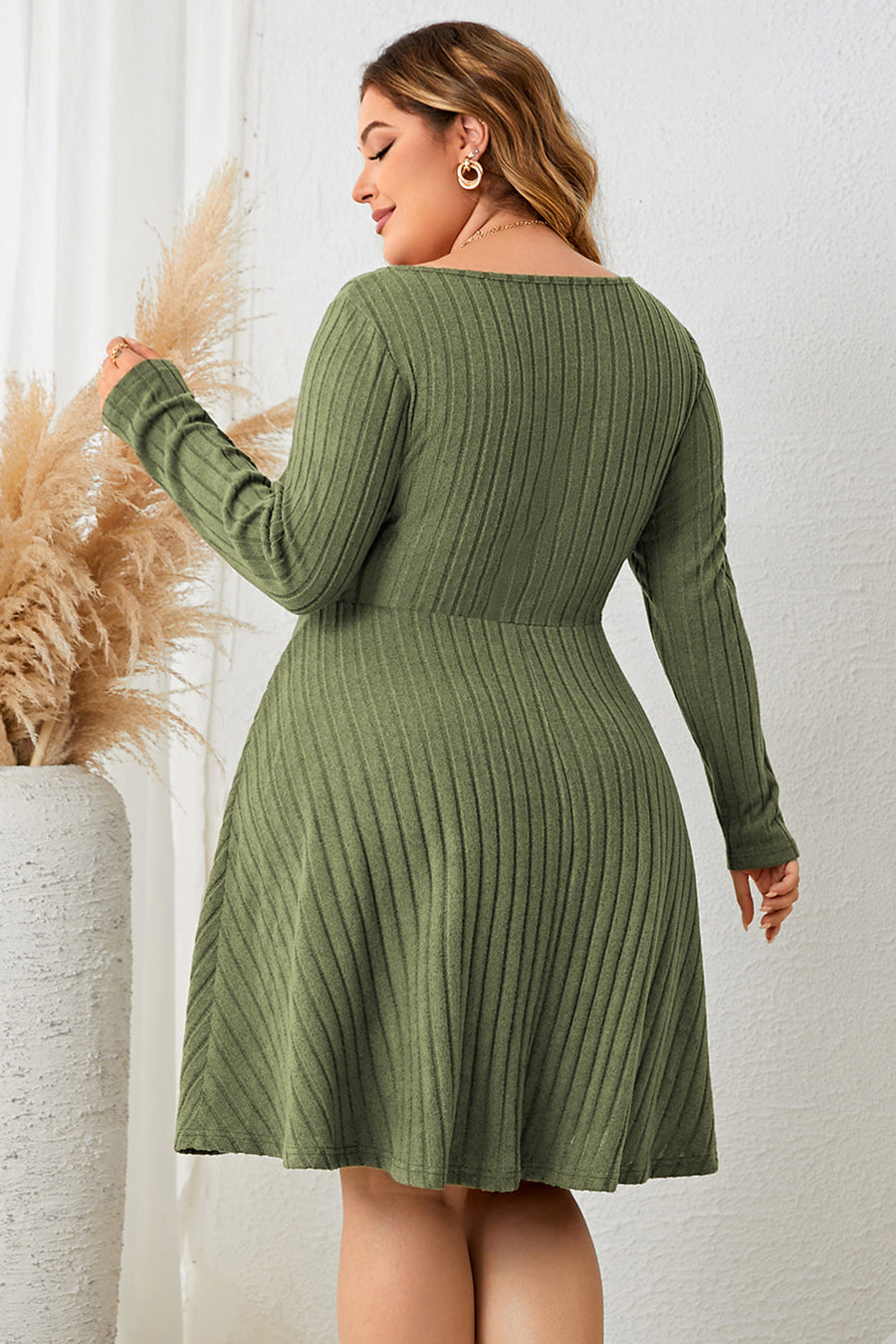 Matcha green ribbed fit-and-flare midi dress with long sleeves and tie front detail.