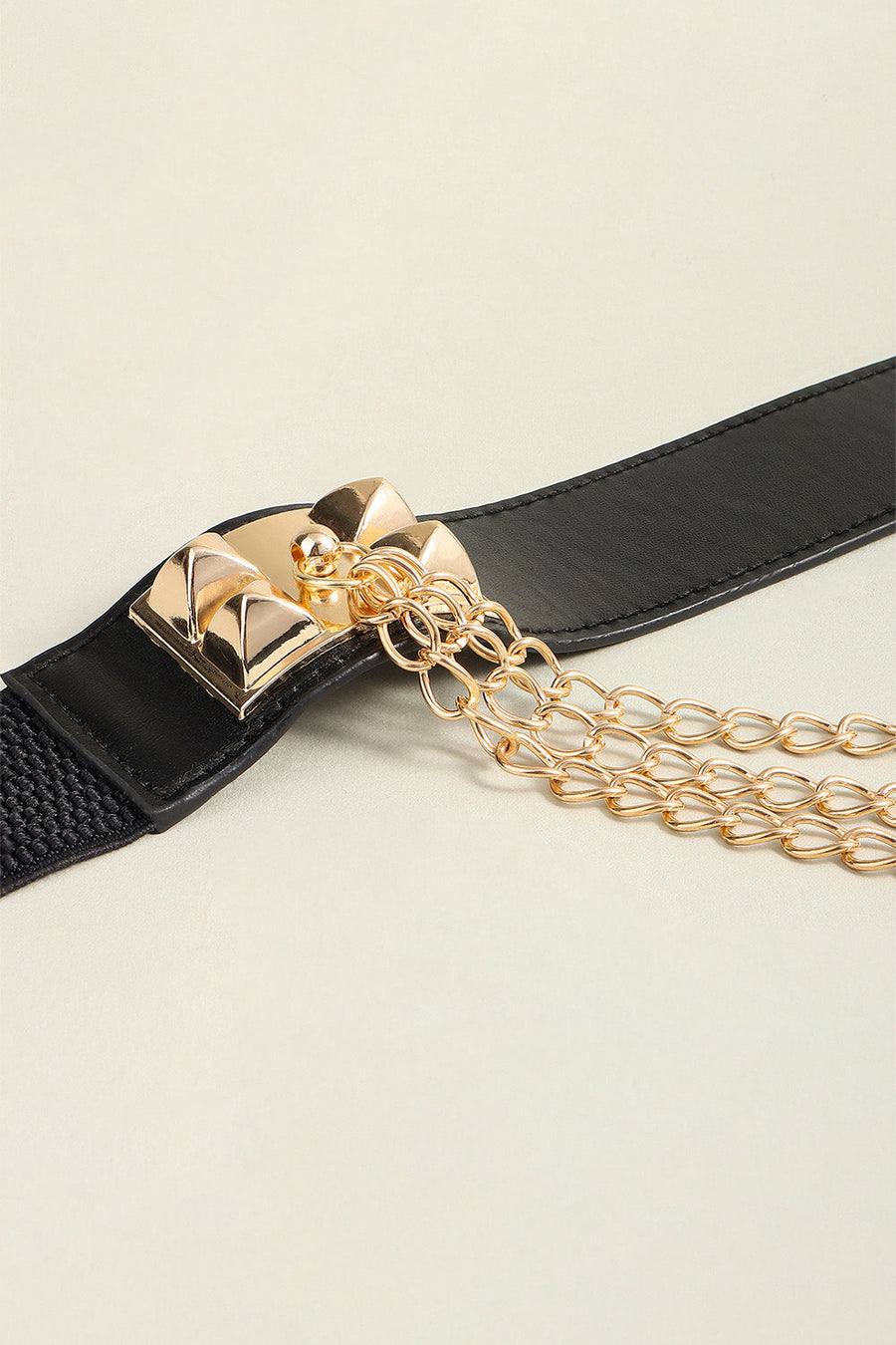 Black elastic belt with gold spiked buckle and layered chain detail