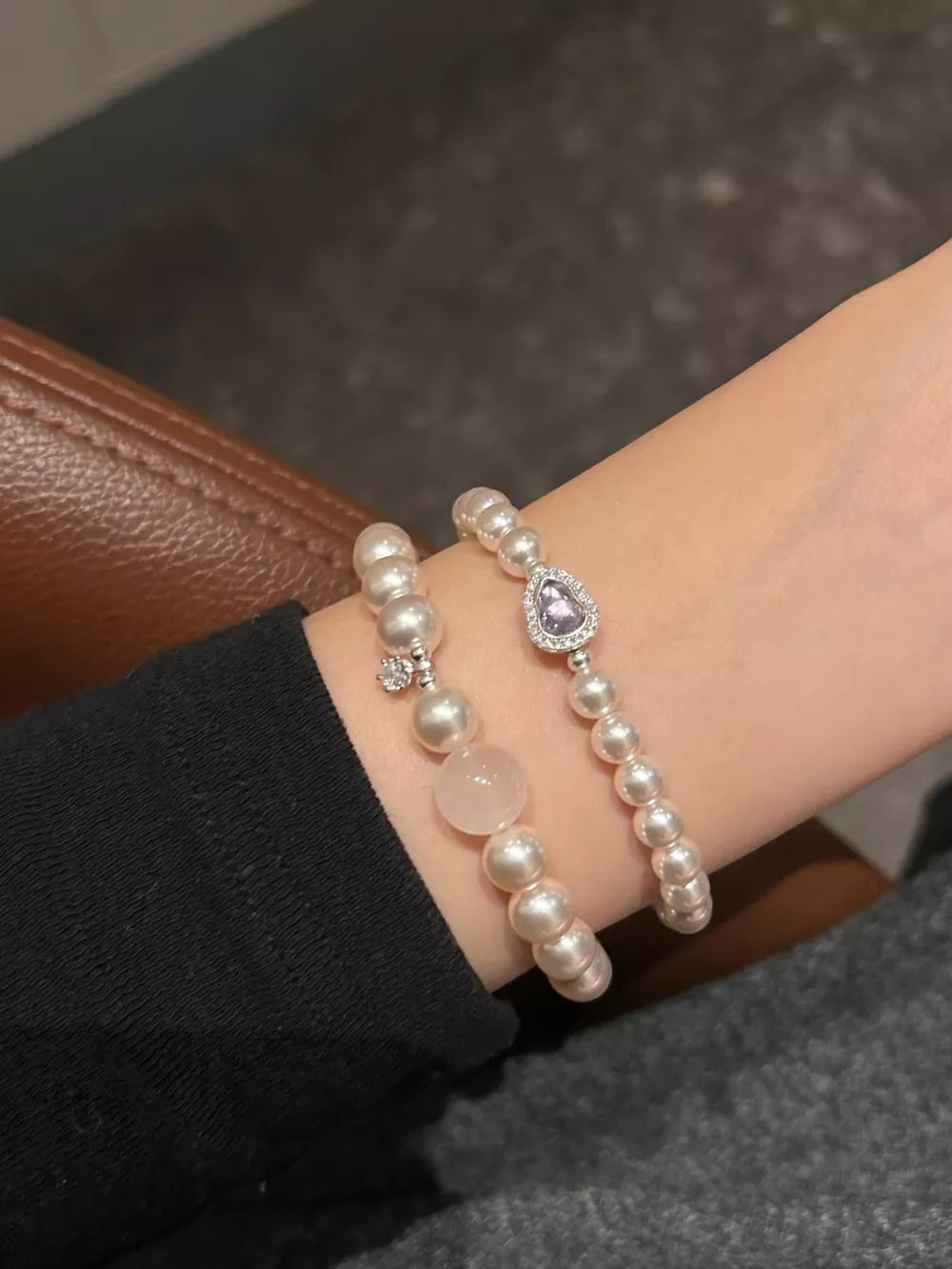 Pearl charm bracelets with pink stone and purple heart crystal detail