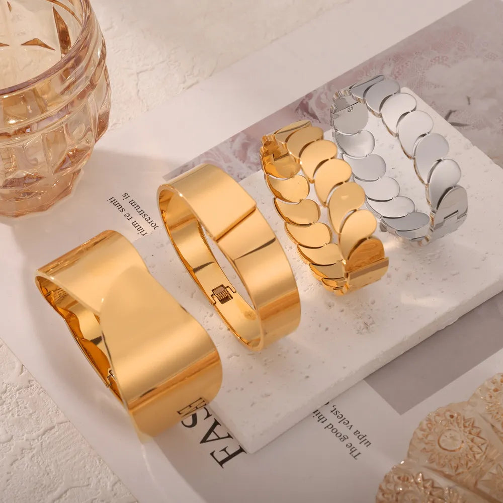 Gold leaf bracelets in Style A and Style C, plus a silver bracelet.