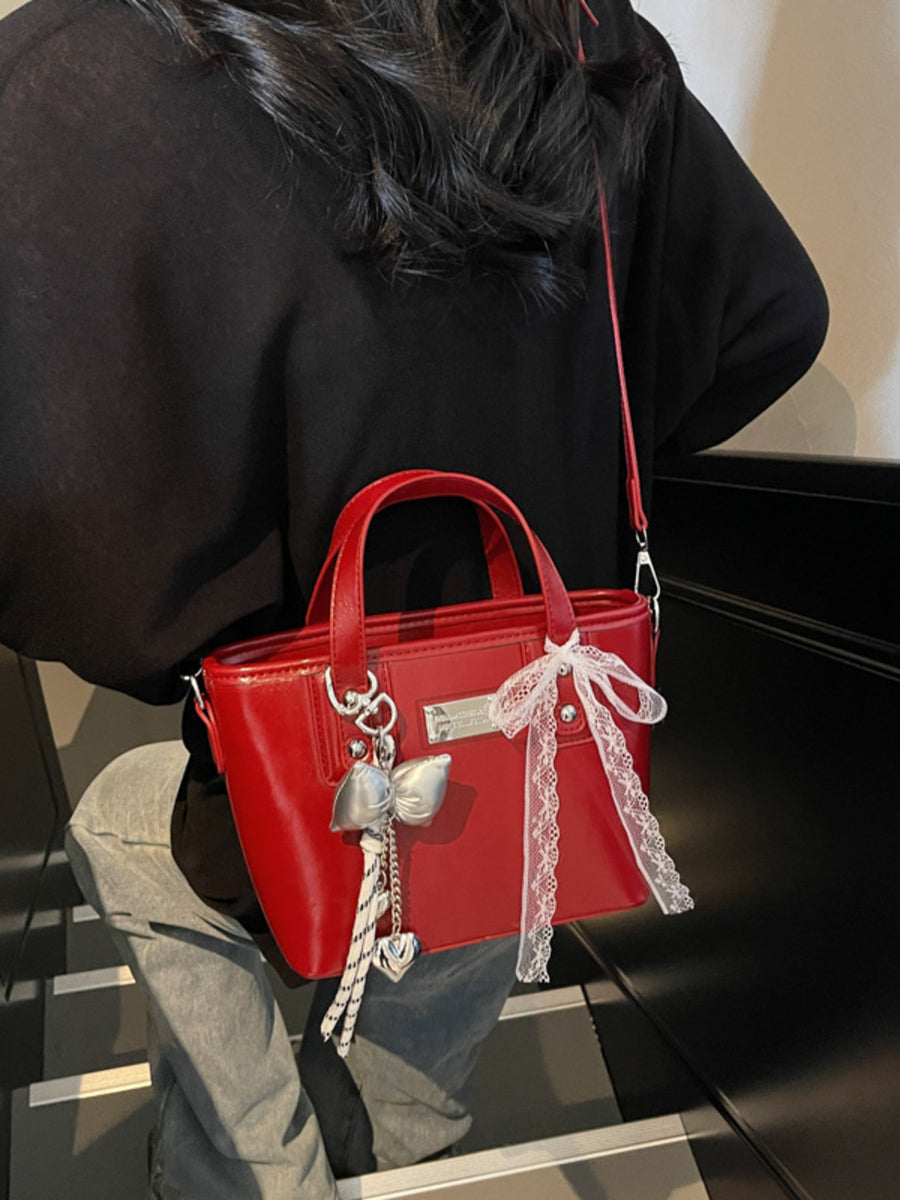 crossbody bag in light gray with top handles and small