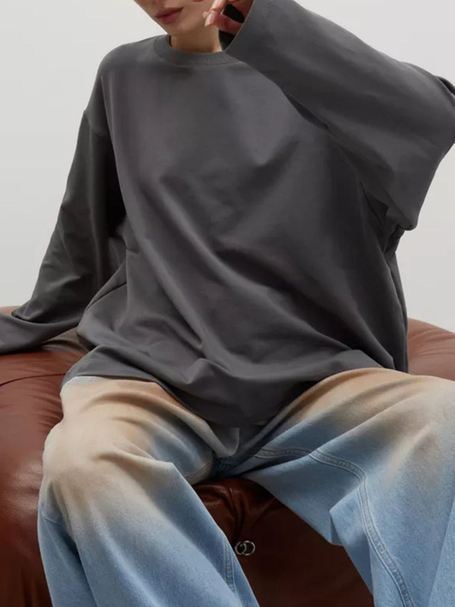 Dark gray oversized crewneck sweatshirt with voluminous sleeves.