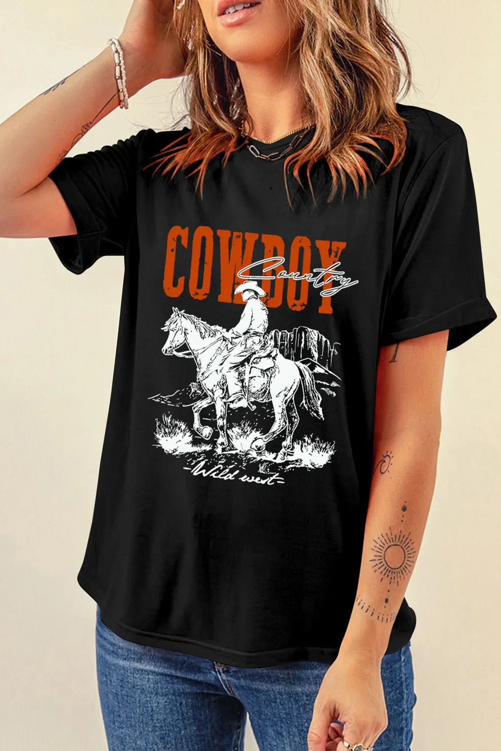 Black graphic tee with cowboy riding a horse and "Cowboy Country" text.