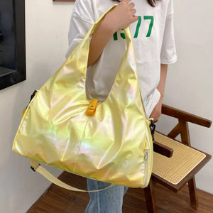 Iridescent pastel yellow PVC large capacity convertible bag with yellow buckle detail.