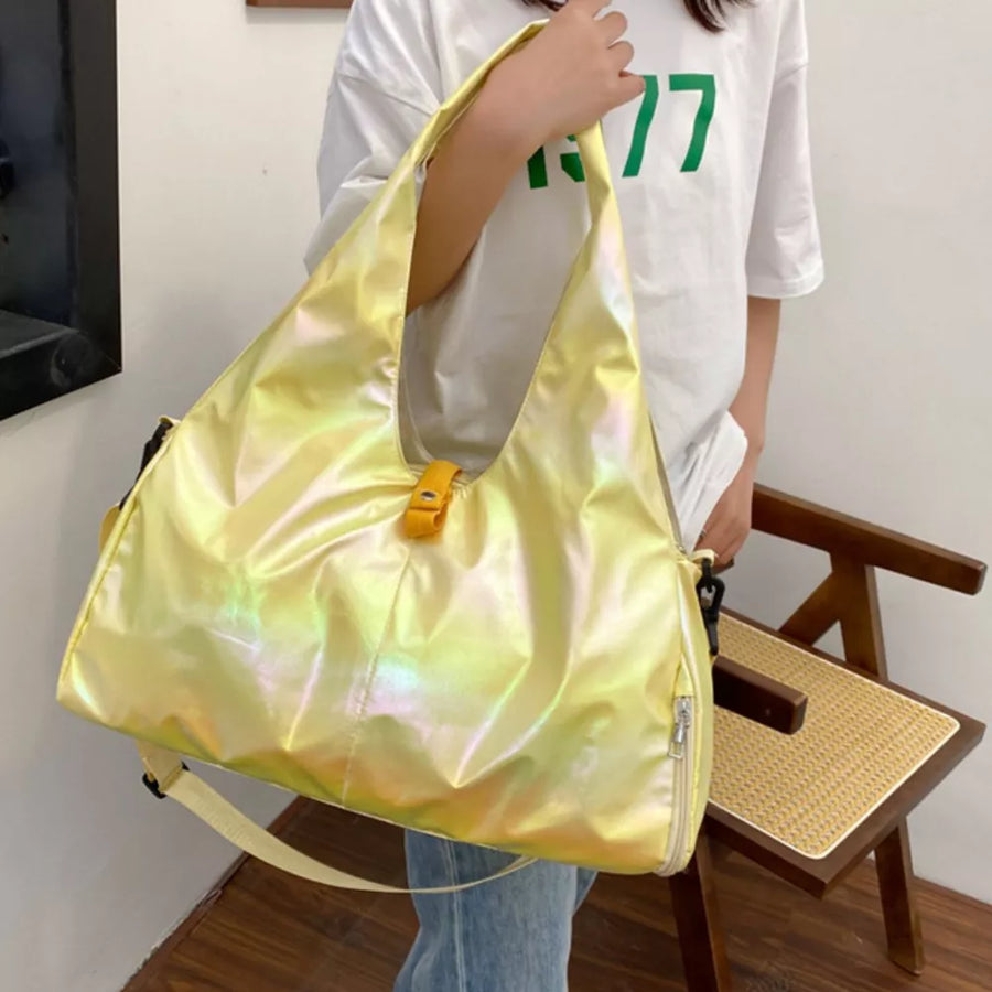 Iridescent pastel yellow PVC large capacity convertible bag with yellow buckle detail.