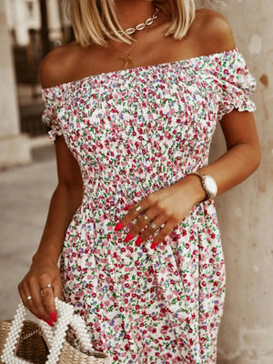 White off-shoulder midi dress with a smocked bodice and a pink floral print.