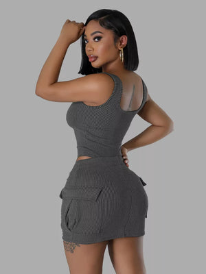 Ribbed grey tank top and cargo mini skirt set with scoop neckline and short sleeves.