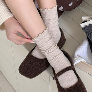 light beige socks with full-length and elastic
