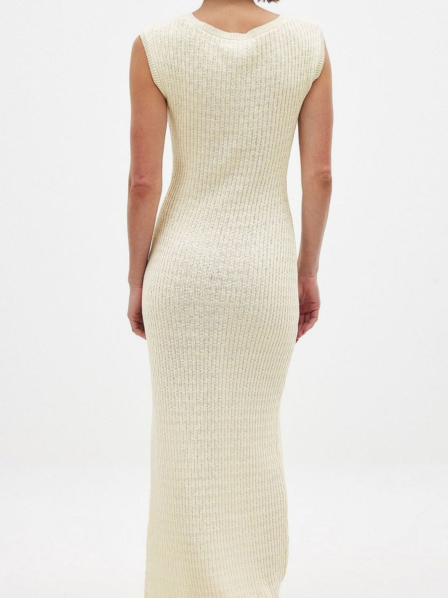 Scoop neck midi knit dress in apricot with a ribbed texture and sleeveless design.