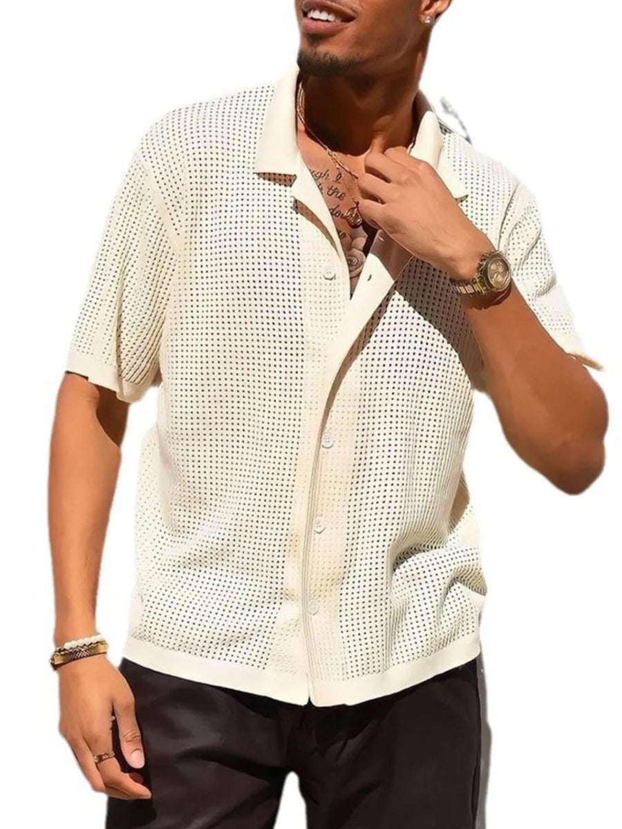Ivory perforated knit resort shirt with short sleeves and a button-up collar.