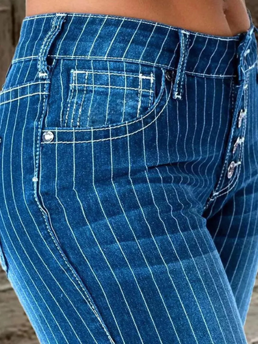 Blue denim maternity jeans with white pinstripes and button fly detail.