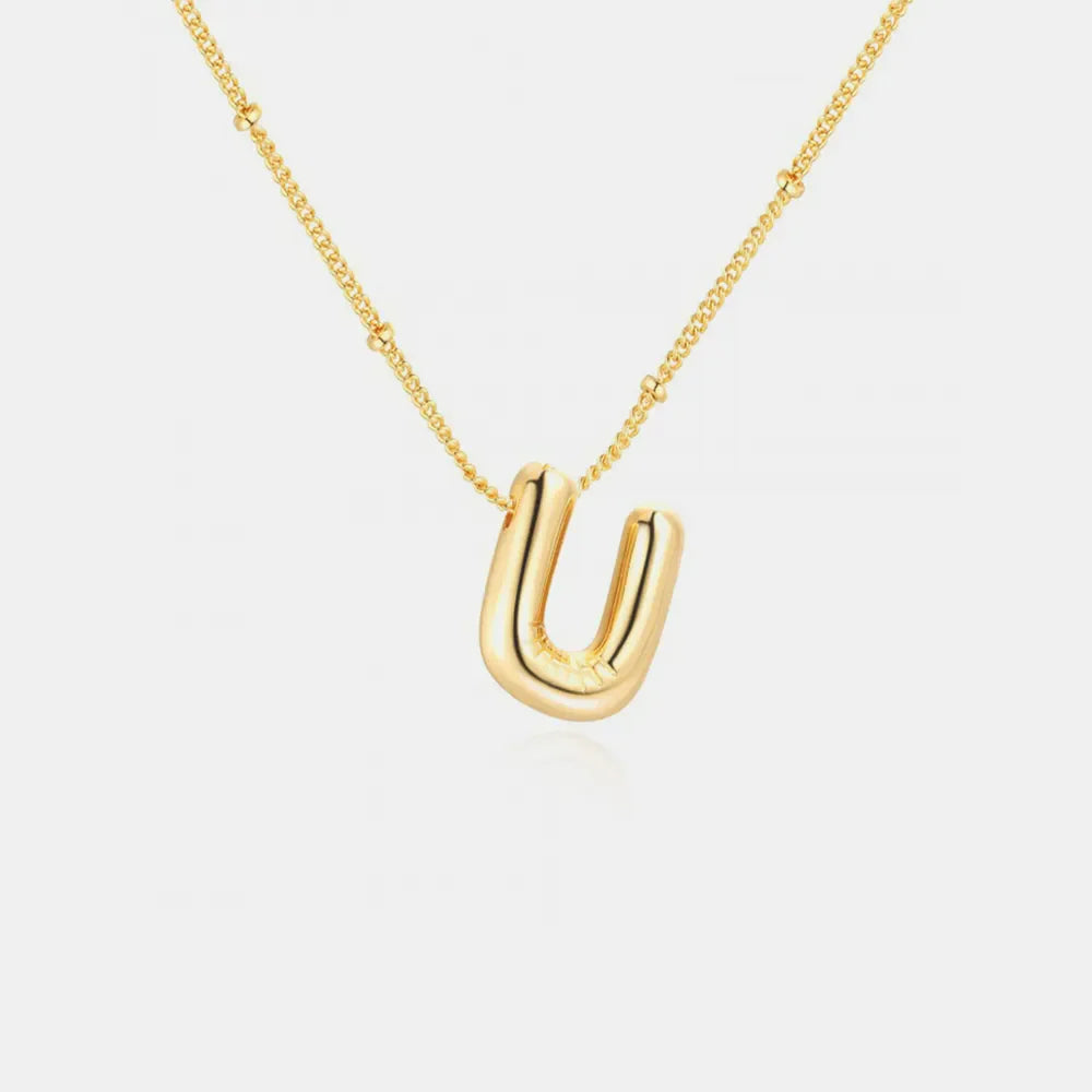 Gold initial necklace with bubbly U pendant and beaded chain