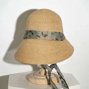 Straw sun hat with floral ribbon detail and defined crown