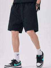 Black relaxed fit chino shorts with drawstring waist and pockets.