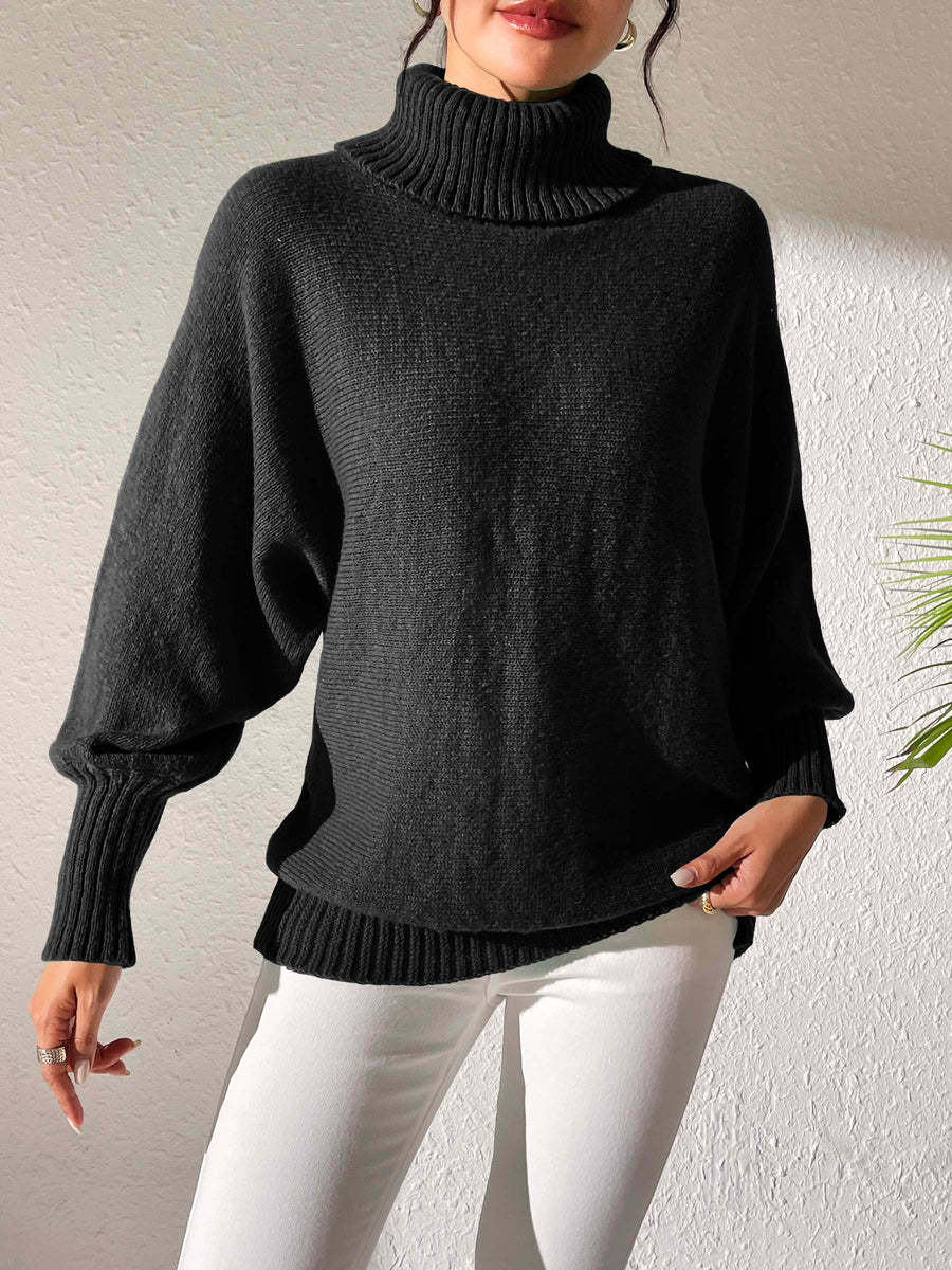 Black balloon sleeve turtleneck sweater with relaxed knit and ribbed cuffs.