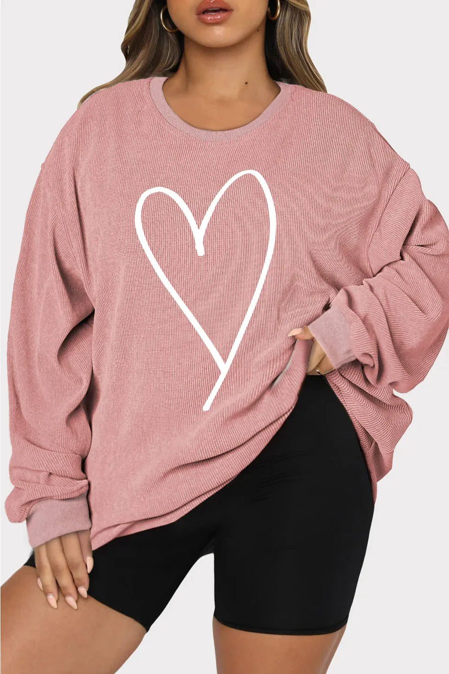 Dusty Pink ribbed crewneck sweatshirt with white heart outline graphic.