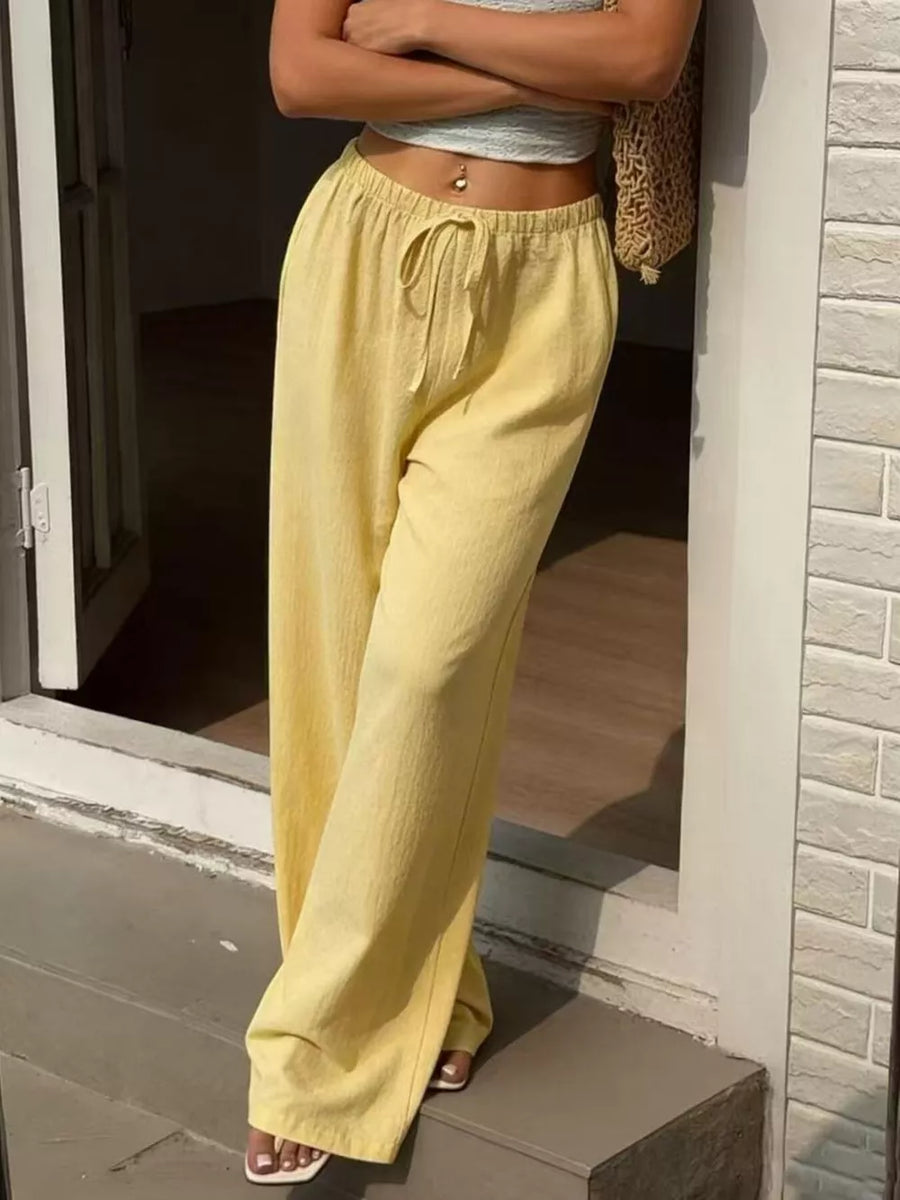 Yellow linen wide-leg pants with drawstring waist and pockets