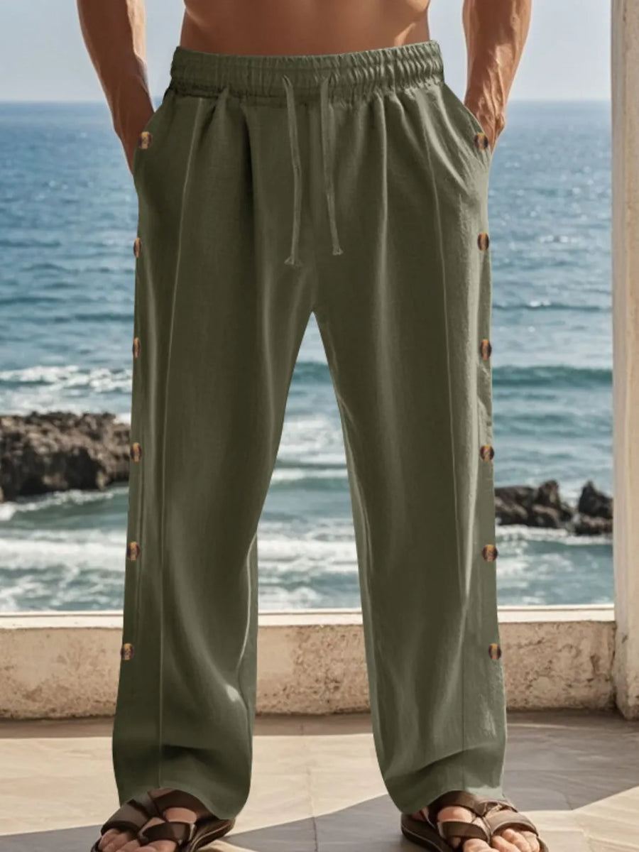 Army green linen palazzo trousers with side buttons and drawstring waist.