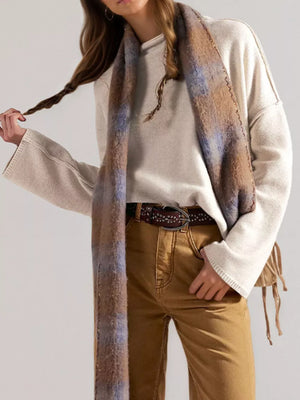 mock neck sweater in ivory featuring ribbed and relaxed fit