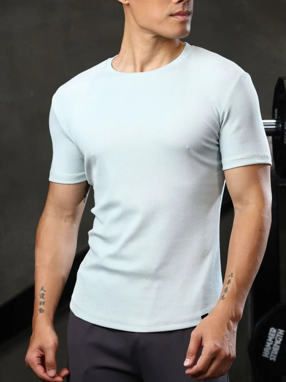 Men's light blue ribbed crewneck tee with short sleeves.