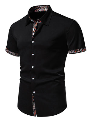 Black short sleeve buttoned shirt with paisley trim on collar, cuffs and hem