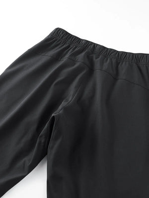 Black plus size men's sweatpants with elastic waistband and side pocket detail.