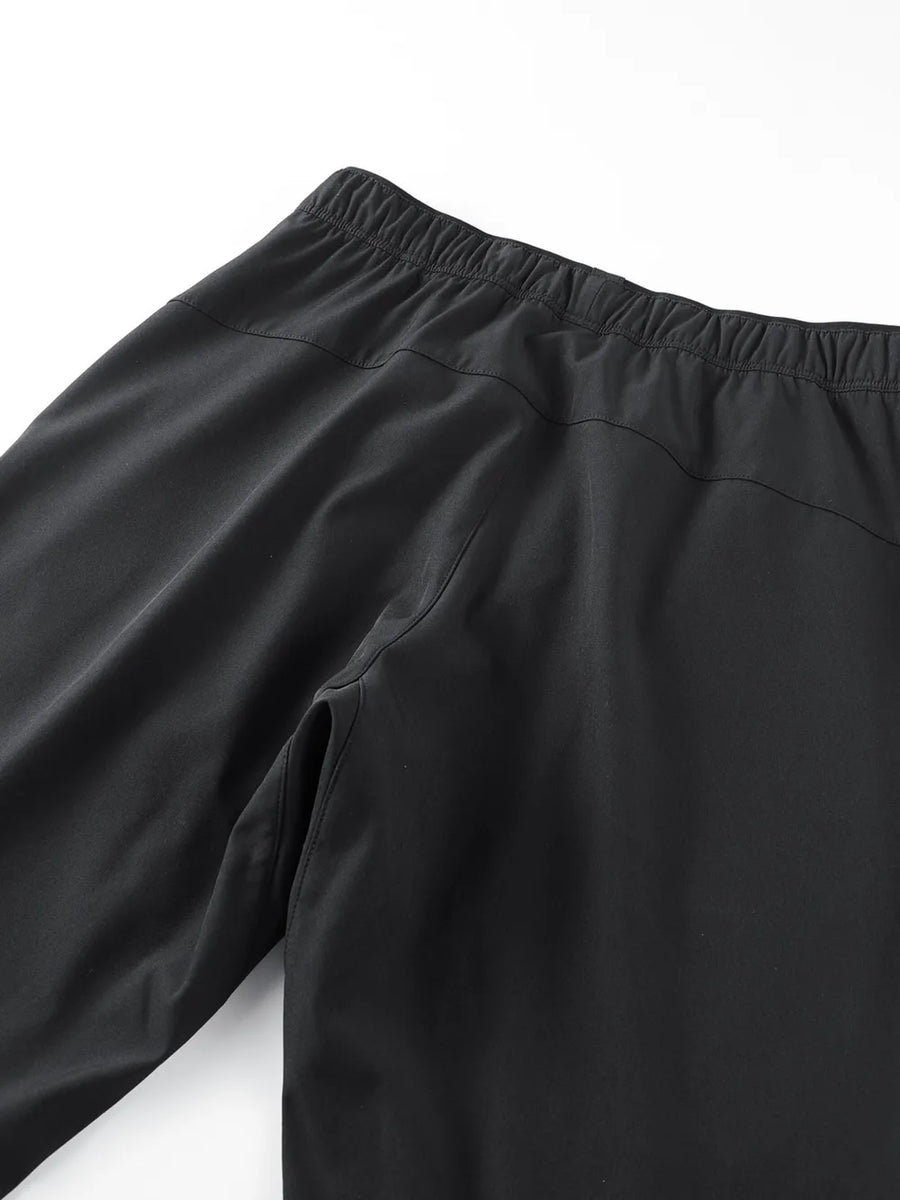 Black plus size men's sweatpants with elastic waistband and side pocket detail.