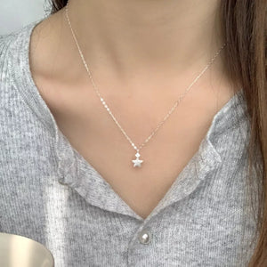 necklace in silver with geometric and star pendant